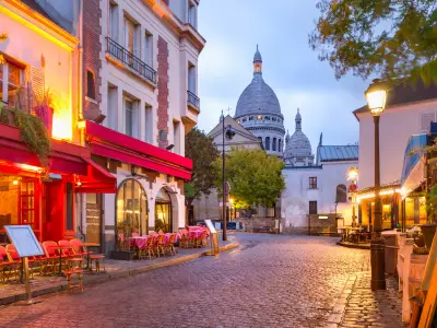 The Place du Tertre with tables of cafe and the Sacre-Coeur in the morning, quarter Montmartre in Paris, France